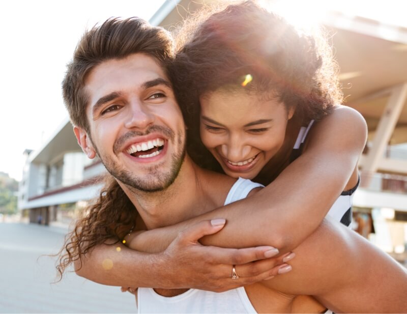 Young man and woman embracing