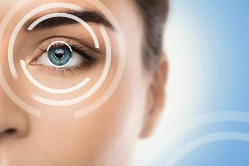 Woman with diagram of circles over her eye representing technology
